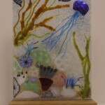 Fused glass free standing panel of a coral reef Fused glass free standing panel of a coral reef